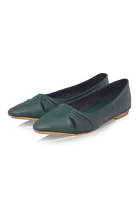 Pair of green flat shoes on a white background