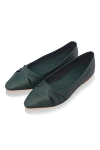 Pair of green flat shoes on a white background
