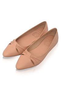 Pair of beige flat shoes on a white background