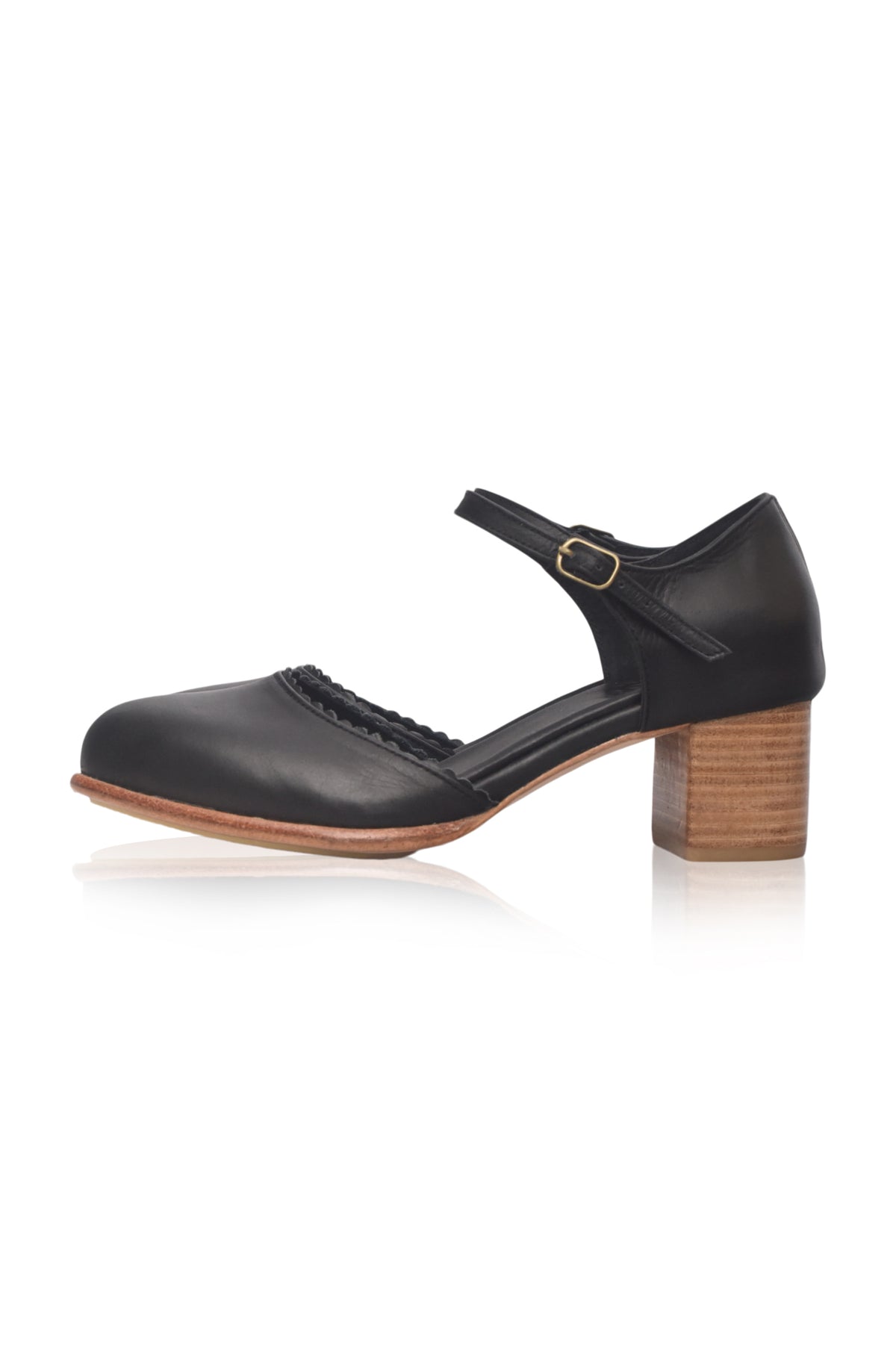A single black leather Mary Jane-style shoe with a block heel and a small gold buckle, shown from the side on a white background.