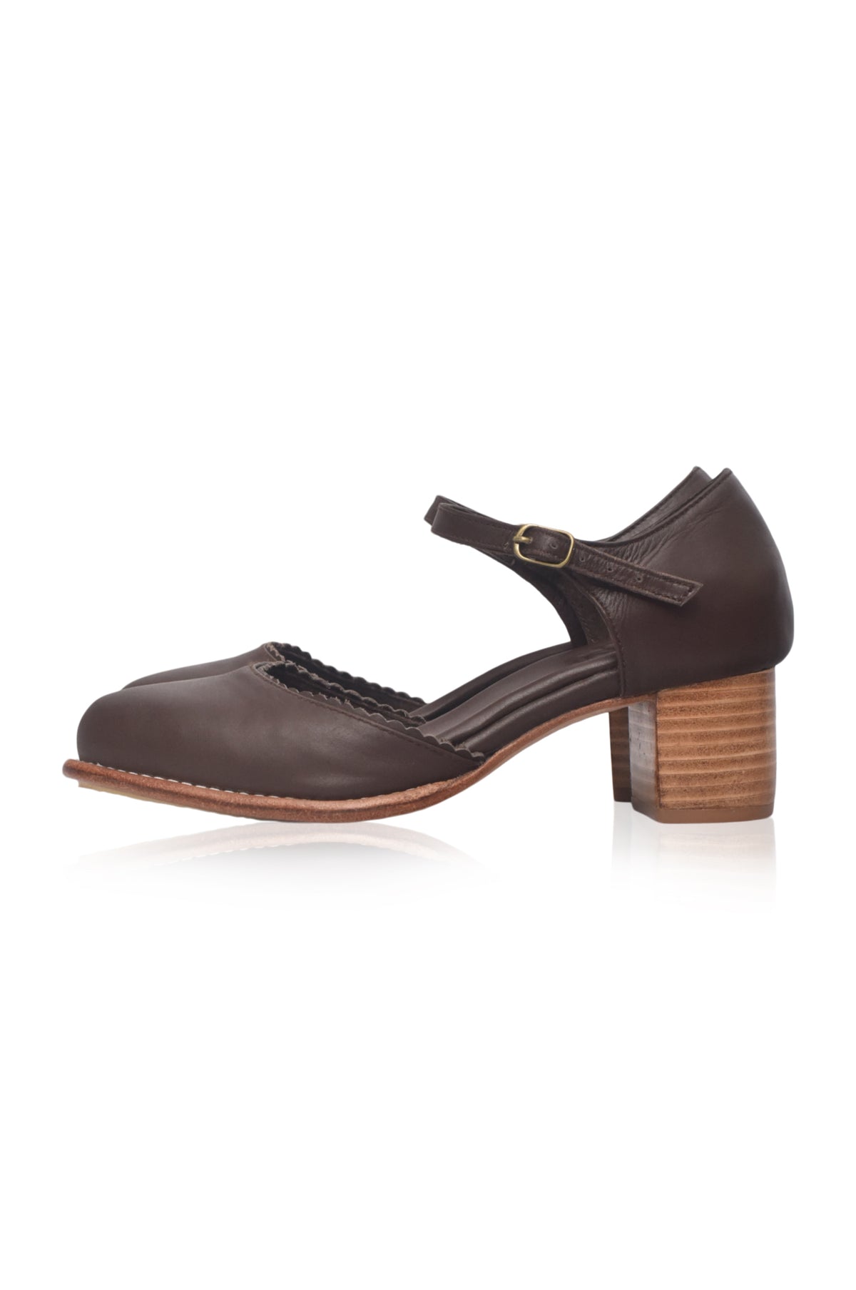 A dark brown leather Mary Jane-style shoe with a low block heel, a decorative braided detail across the instep, and a small gold buckle on the ankle strap, shown against a plain white background.