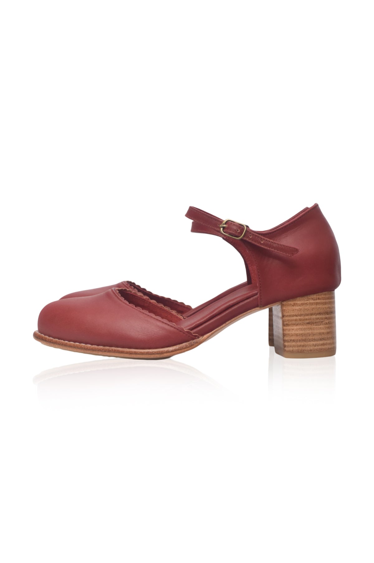 A single women's Mary Jane style shoe in burgundy red leather with a low block heel and a brown wooden-textured heel, shown from a side profile on a white background.