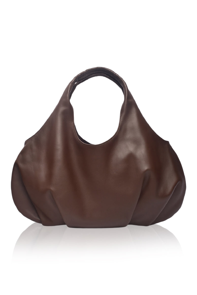 Brown leather handbag on a white background