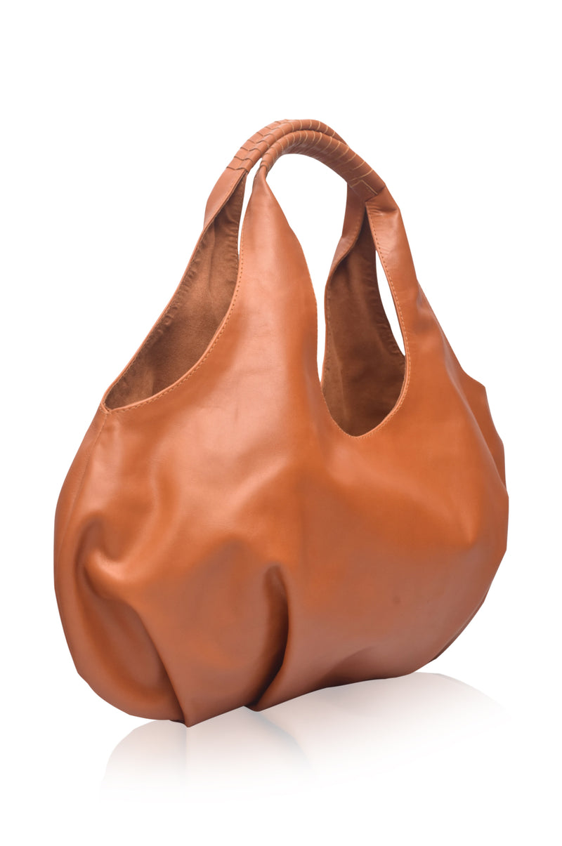 Brown leather handbag on a white background