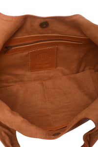 Close-up of a brown leather bag with a visible brand logo on a white background