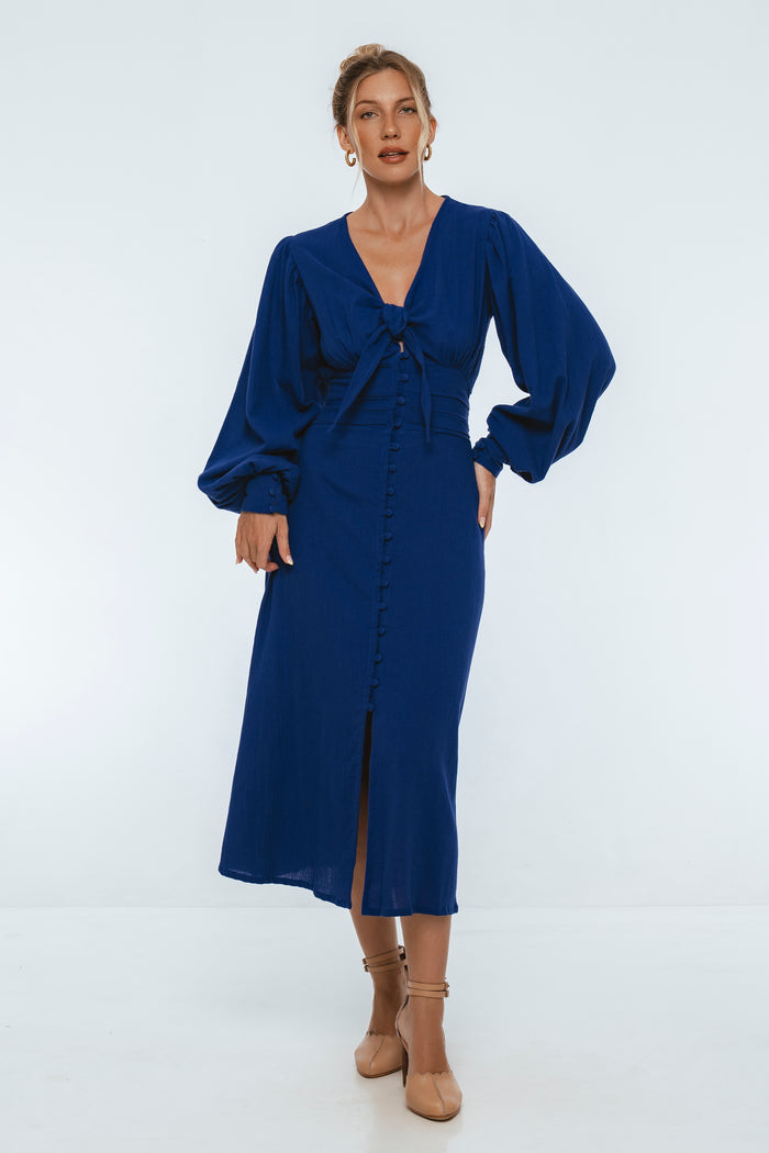 Woman wearing a blue dress on a white background