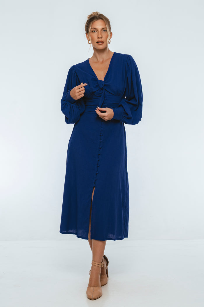 Woman wearing a blue dress on a white background