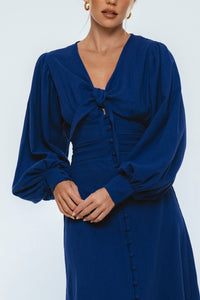 Blue dress with long sleeves on a white background