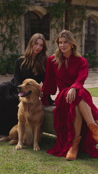 video of models with the do wearing dresses in black and maroon