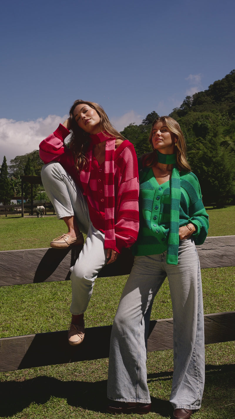 Video of knitted sweaters in stripes. Red and Green Sweaters